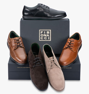 Black shoe box surrounded by Fibonacci shoes